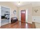 Inviting foyer featuring hardwood floors, and a view to the main bedroom at 316 Cranmore Pl, Villa Rica, GA 30180