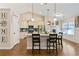 Bright kitchen with granite countertops, stainless steel appliances, a pantry, and stylish pendant lighting at 316 Cranmore Pl, Villa Rica, GA 30180