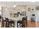 Charming kitchen featuring a spacious island, granite countertops, pendant lighting, and stainless steel appliances at 316 Cranmore Pl, Villa Rica, GA 30180