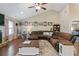Cozy living room featuring hardwood floors, neutral paint, and a large sectional sofa at 316 Cranmore Pl, Villa Rica, GA 30180