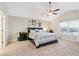 Relaxing main bedroom with a ceiling fan, large window, and neutral tones creating a serene retreat at 316 Cranmore Pl, Villa Rica, GA 30180