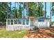 Charming cottage with large windows offering abundant natural light and picturesque views at 409 Mitchell Rd, Covington, GA 30014