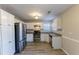 A kitchen with stainless steel appliances, white cabinets, and laminate countertops at 527 Carlton Pointe Dr, Palmetto, GA 30268