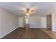 Bright, open living room with multiple entryways and hard surface floors at 527 Carlton Pointe Dr, Palmetto, GA 30268