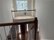 Upstairs view of foyer with decorative window and chandelier at 722 Thornapple Trl, Lawrenceville, GA 30046