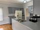 Well-maintained kitchen with blue-grey cabinets, modern fixtures, and ample counter space at 722 Thornapple Trl, Lawrenceville, GA 30046