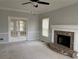 Inviting living room features a brick fireplace, neutral walls, and natural light at 722 Thornapple Trl, Lawrenceville, GA 30046