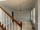Comfortable carpeted room with classic chandelier and neutral tones offers versatile living space at 722 Thornapple Trl, Lawrenceville, GA 30046