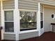 Exterior view of the home's windows with the screened in porch to the right at 722 Thornapple Trl, Lawrenceville, GA 30046