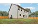 Spacious backyard with wooden fence, lawn, and view of the home's exterior at 1511 New Hope Rd, Locust Grove, GA 30248