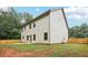 Spacious backyard with a well-maintained lawn and a wooden fence, perfect for outdoor activities at 1511 New Hope Rd, Locust Grove, GA 30248