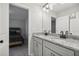 Modern bathroom with double sink vanity, granite countertop, and updated fixtures and hardware at 1511 New Hope Rd, Locust Grove, GA 30248