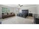 Spacious main bedroom with a seating area, large windows, and plush carpeting at 1511 New Hope Rd, Locust Grove, GA 30248