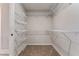 Walk-in closet boasts adjustable wire shelving for optimal storage and organization at 1511 New Hope Rd, Locust Grove, GA 30248