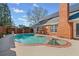 Beautiful in-ground pool with spa, brick features, and fenced yard at 290 Connemara Ne Dr, Marietta, GA 30067