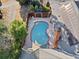 Overhead view of a backyard with a pool, brick accents, solar panels, and lush trees, highlighting outdoor fun at 290 Connemara Ne Dr, Marietta, GA 30067