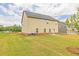 Grassy backyard showcasing the home's siding and pleasant outdoor space at 300 Bianca Way, Mcdonough, GA 30253