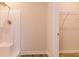 White-tiled shower with a built-in seat and modern fixtures, adjacent to a walk-in closet for added convenience at 300 Bianca Way, Mcdonough, GA 30253