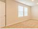 Bedroom with neutral carpet, white walls and a double window at 300 Bianca Way, Mcdonough, GA 30253