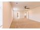 Well-lit bedroom with a ceiling fan and plush carpet, featuring an open doorway for easy access to other rooms at 300 Bianca Way, Mcdonough, GA 30253