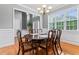 Formal dining room with hardwood floors, wainscoting, and ample natural light at 308 Helena Pl, Mcdonough, GA 30252