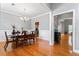 Formal dining room with hardwood floors, wainscoting, and ample natural light at 308 Helena Pl, Mcdonough, GA 30252