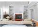 Comfortable living room featuring a fireplace, built-in shelves, and plush seating at 308 Helena Pl, Mcdonough, GA 30252