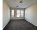This bedroom has neutral paint, carpet, and bright windows at 898 Oak Sw St # 3109, Atlanta, GA 30310