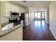 Open concept kitchen with stainless steel appliances, granite countertops, and hardwood floors blends style and convenience at 898 Oak Sw St # 3109, Atlanta, GA 30310