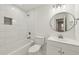 Bathroom featuring white tile around the tub, toilet, and sink at 1700 Shirley Sw St, Atlanta, GA 30310