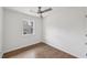 Bedroom showing hardwood floors, a window, and a ceiling fan at 1700 Shirley Sw St, Atlanta, GA 30310