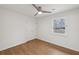 Bright bedroom featuring hardwood floors, a ceiling fan, and a window at 1700 Shirley Sw St, Atlanta, GA 30310