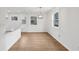 Open dining area with new floors, light fixture, and natural light at 1700 Shirley Sw St, Atlanta, GA 30310