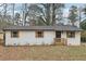Charming renovated brick home with black trim, wooden shutters, and a new roof at 1700 Shirley Sw St, Atlanta, GA 30310