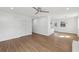 Open floor plan with new floors, neutral walls, ceiling fan, and natural light at 1700 Shirley Sw St, Atlanta, GA 30310
