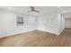 Spacious living room with hardwood flooring, ceiling fan, and closet storage at 1700 Shirley Sw St, Atlanta, GA 30310