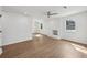 Bright living room with refinished fireplace, ceiling fan, and gorgeous new flooring at 1700 Shirley Sw St, Atlanta, GA 30310