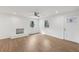 Bright living room boasts fresh paint, new flooring, refinished fireplace, and plenty of light at 1700 Shirley Sw St, Atlanta, GA 30310