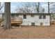 View of the home's rear exterior, showing a deck and landscaped yard at 1700 Shirley Sw St, Atlanta, GA 30310