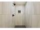 This is a shower with glass tile and bronze hardware at 1700 Shirley Sw St, Atlanta, GA 30310