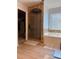 Bathroom featuring a separate tub and shower with neutral tile and wood-look floors at 3331 Freedom Nw Lndg, Kennesaw, GA 30144