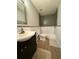 Updated bathroom with tub-shower, tile surround, modern vanity, and wood-look floors at 3331 Freedom Nw Lndg, Kennesaw, GA 30144