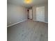 Carpeted bedroom with neutral walls and door to another room at 3331 Freedom Nw Lndg, Kennesaw, GA 30144