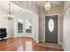 Elegant entryway with hardwood floors, a bay window, and a stylish front door with decorative glass at 3331 Freedom Nw Lndg, Kennesaw, GA 30144