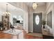 Inviting entryway features gleaming hardwood floors, stylish decor, and bright natural light from the adjacent office area at 3331 Freedom Nw Lndg, Kennesaw, GA 30144