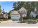 Charming two-story home features a well-maintained lawn, mature trees, and a two-car garage at 3331 Freedom Nw Lndg, Kennesaw, GA 30144