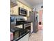 Updated kitchen featuring stainless steel appliances, light cabinets, and granite countertops at 3331 Freedom Nw Lndg, Kennesaw, GA 30144