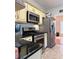 Updated kitchen featuring stainless steel appliances, light cabinets, and granite countertops at 3331 Freedom Nw Lndg, Kennesaw, GA 30144