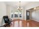 Bright living room featuring hardwood floors, a bay window, and neutral paint at 3331 Freedom Nw Lndg, Kennesaw, GA 30144