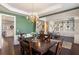 Dining room and entryway showcasing hardwood floors, wainscoting and an elegant chandelier at 3405 Belridge Se Dr, Smyrna, GA 30080